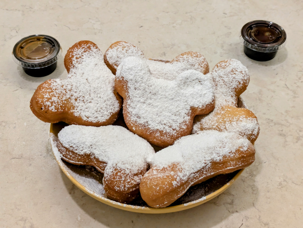 A fresh plate of powdered sugar Mickey shaped beignets from Scat Cat's Club.